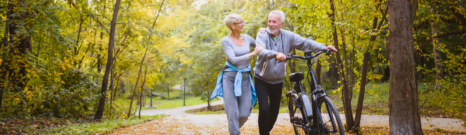 Mature couple walking on a path outside