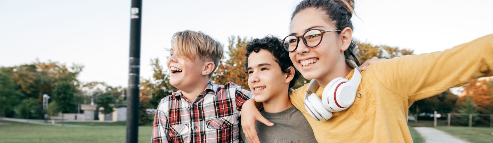 Kids embracing while enjoying the outdoors