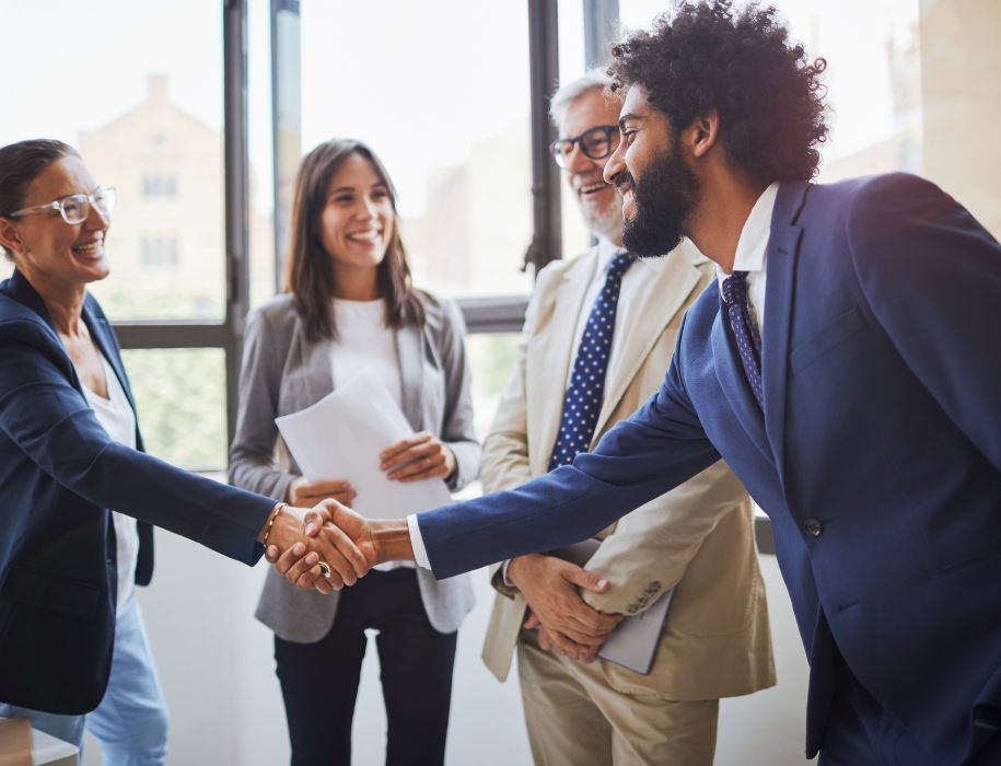 Business professionals shaking hands